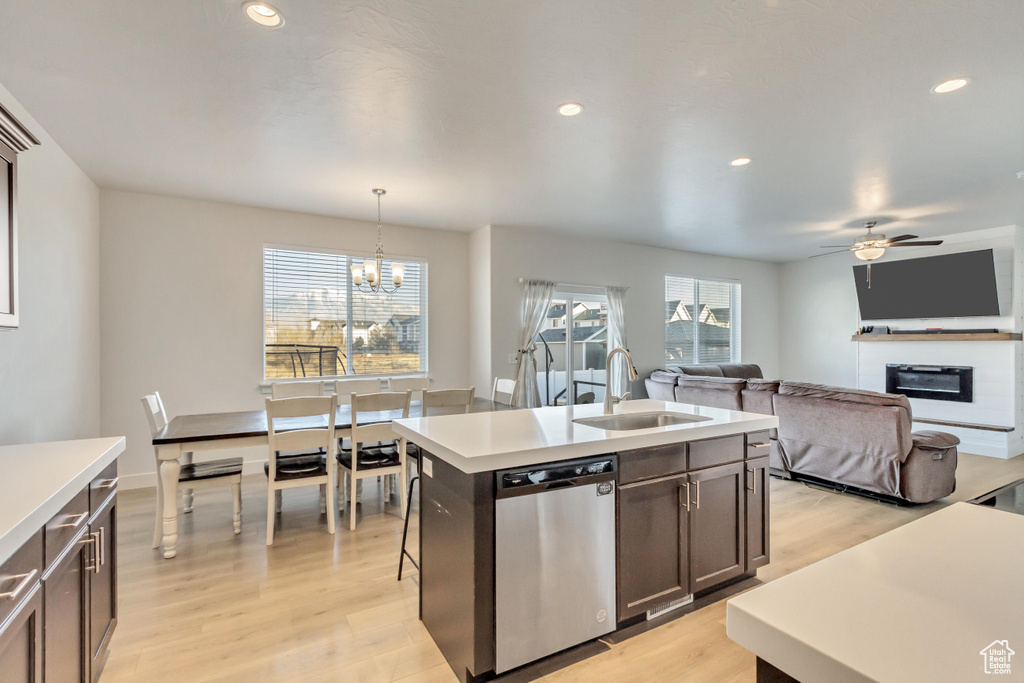 Kitchen with pendant lighting, stainless steel dishwasher, plenty of natural light, and sink