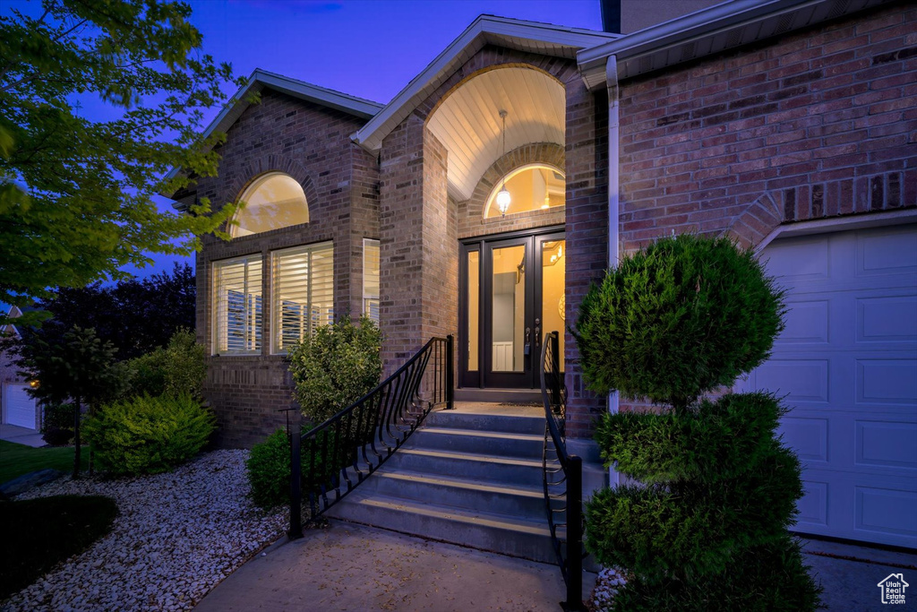 Doorway to property with brick siding