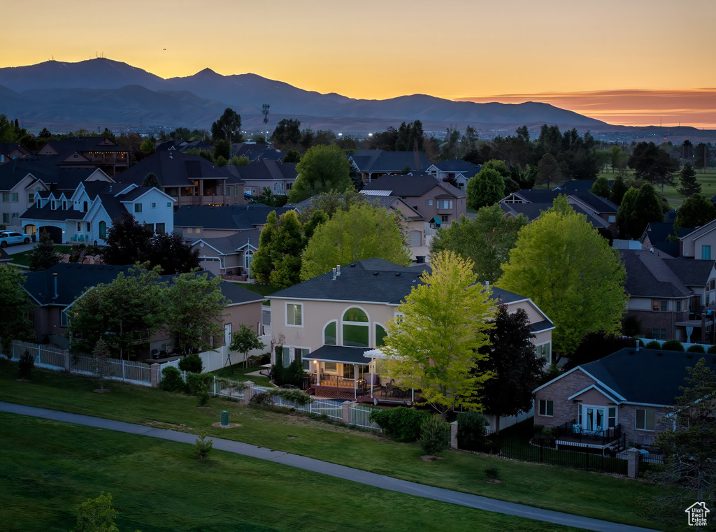 Aerial view at dusk of a residential view and a mountain view