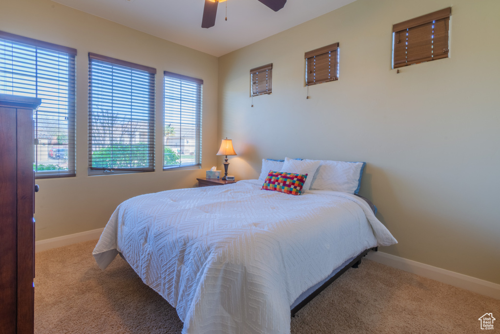 Bedroom featuring carpet floors and ceiling fan