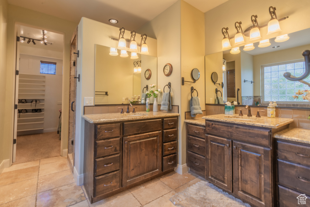 Bathroom with tile patterned flooring and vanity