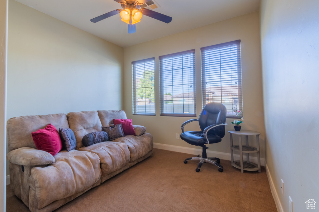 Home office with carpet and ceiling fan