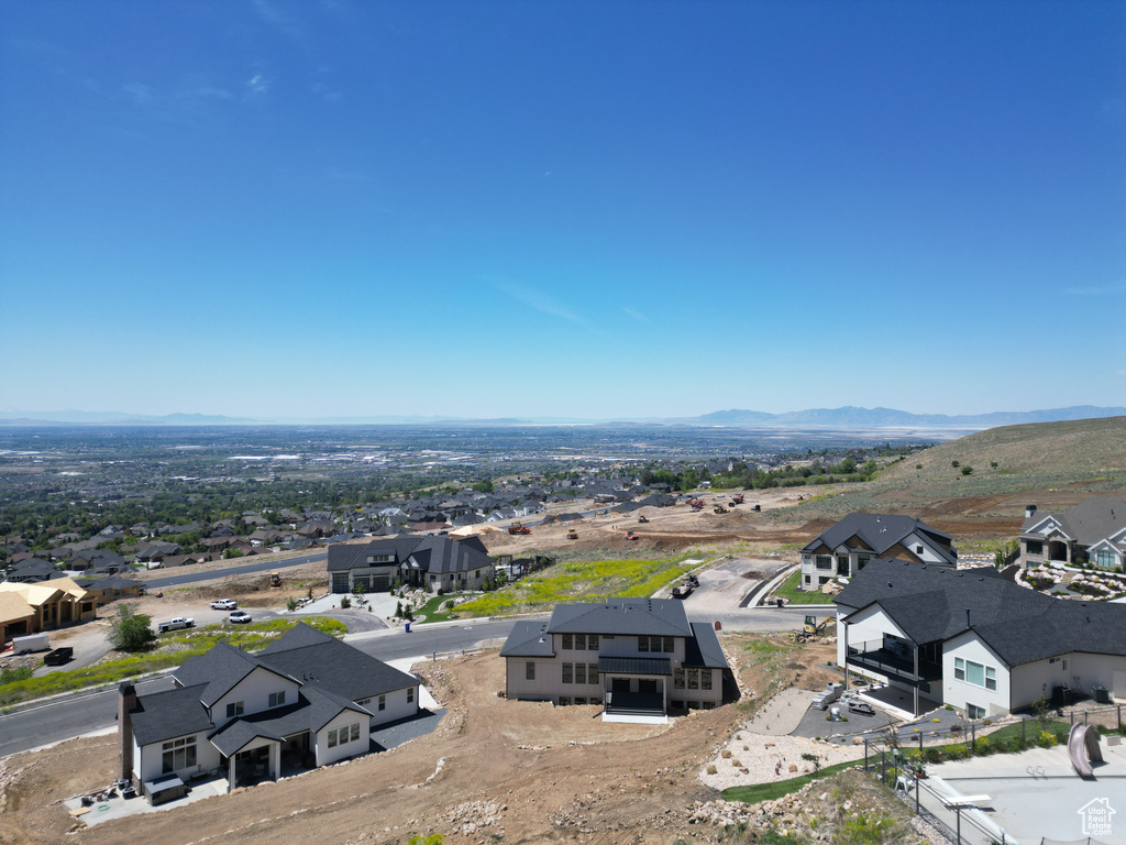 Aerial perspective of suburban area with a mountainous background