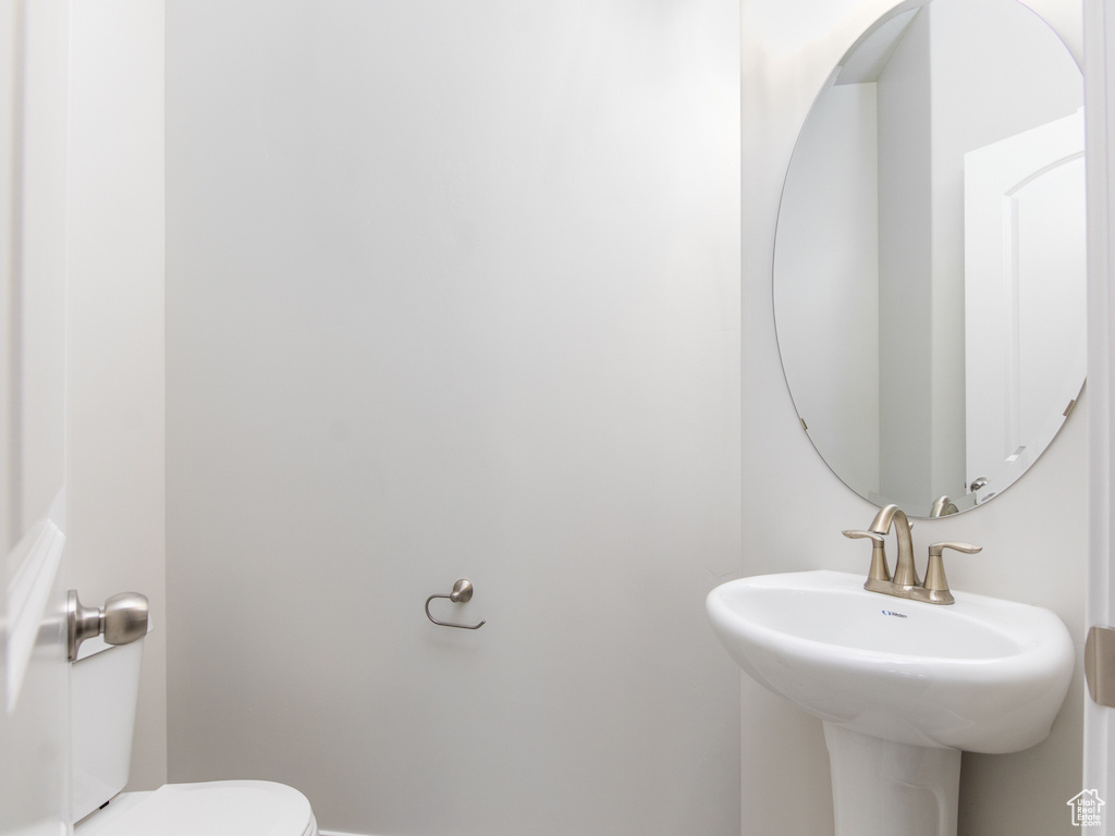 Bathroom featuring toilet and sink