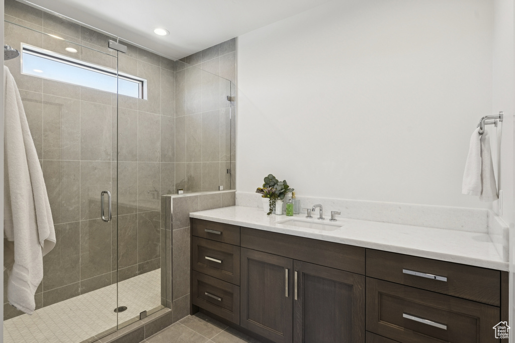Full bathroom with vanity, a shower stall, recessed lighting, and tile patterned floors