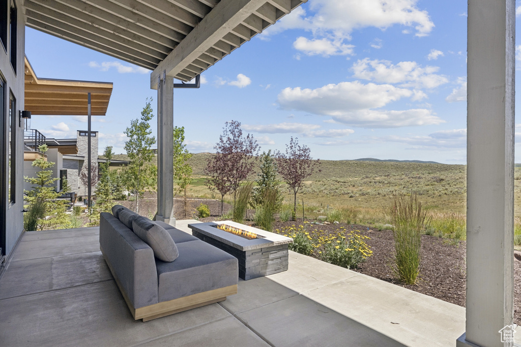 View of patio featuring a fire pit