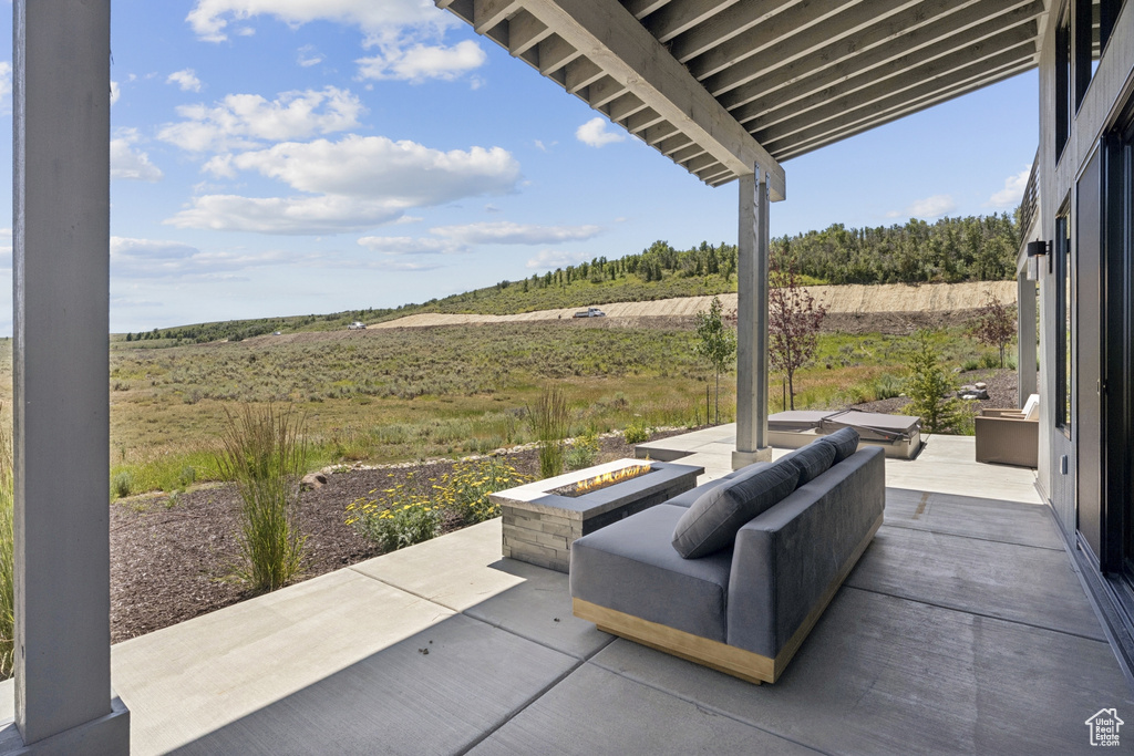 View of patio / terrace featuring a fire pit