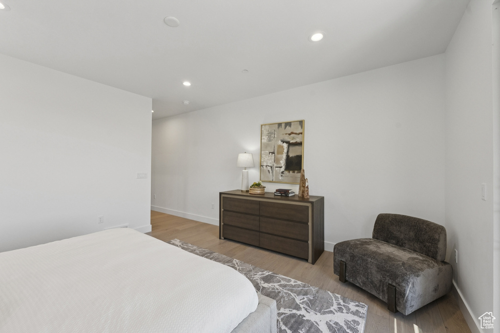 Bedroom with light wood-style flooring and recessed lighting