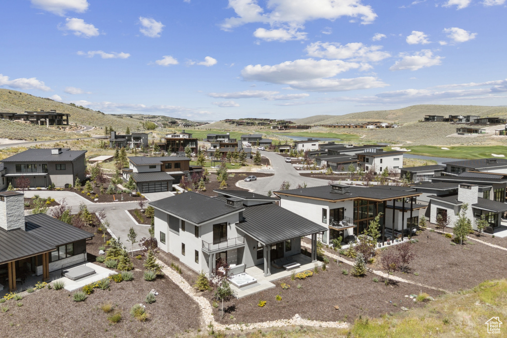 Aerial perspective of suburban area featuring a mountain backdrop