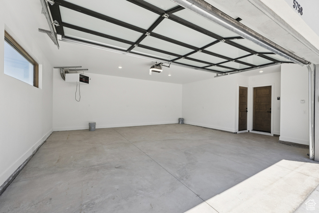Garage featuring baseboards