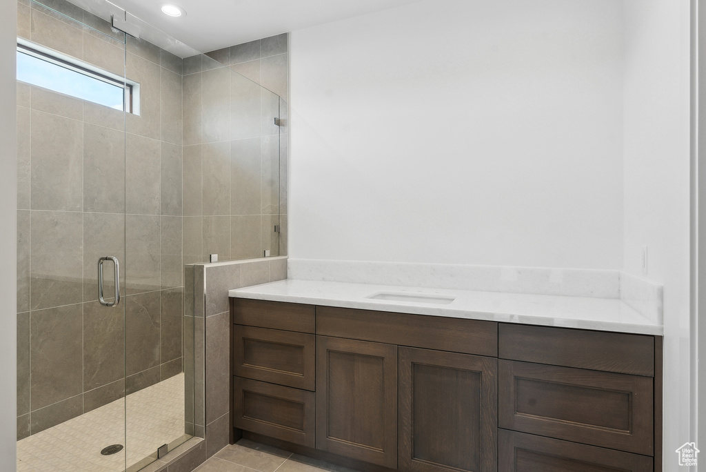 Full bathroom with a shower stall and vanity