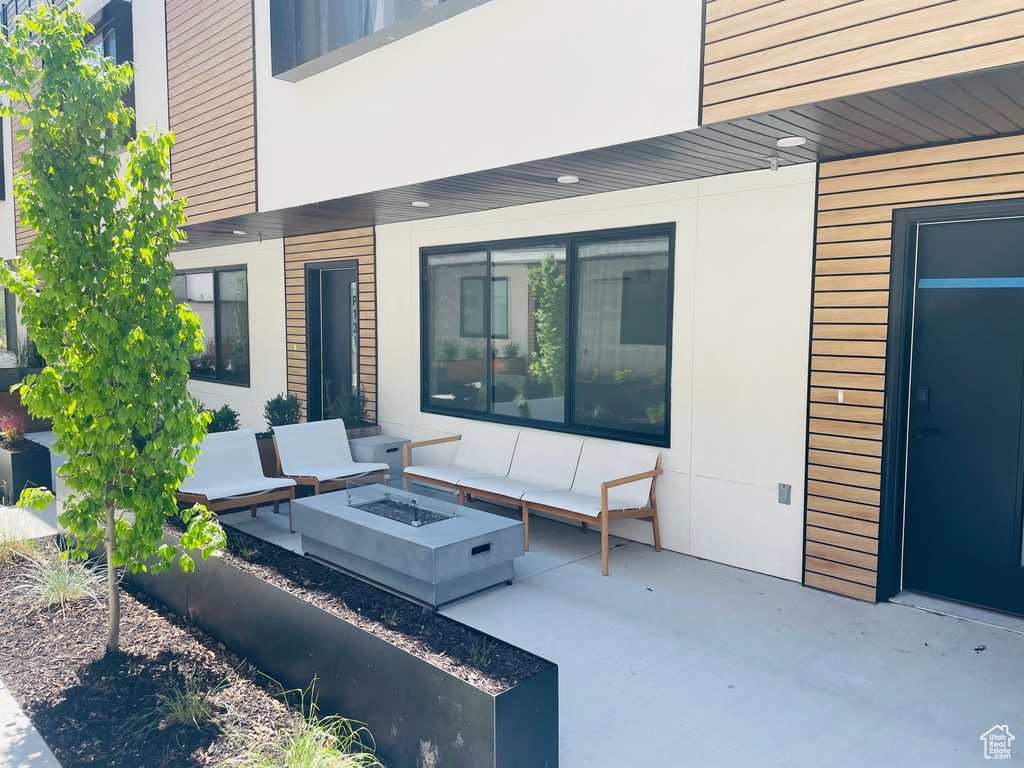 View of patio / terrace featuring an outdoor fire pit