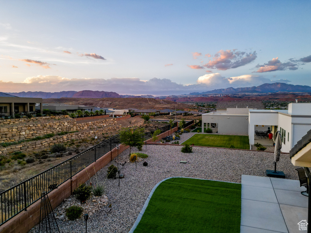 Yard at dusk with a mountain view