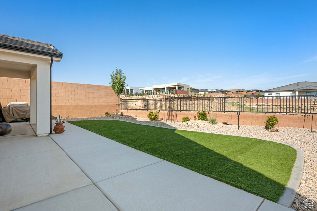 View of yard with a patio area