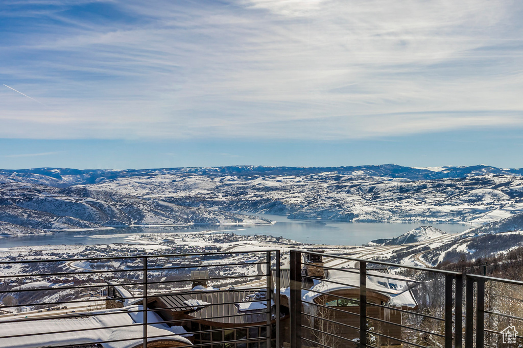 View of mountain backdrop featuring a nearby body of water