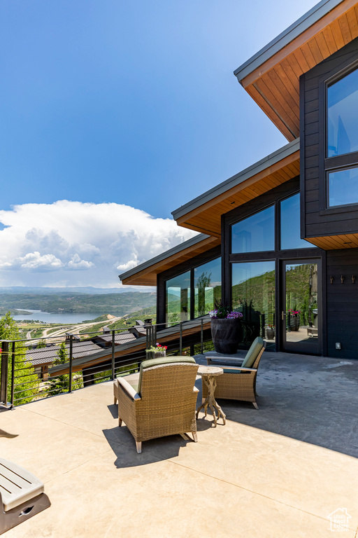 View of patio / terrace with a water view and an outdoor hangout area