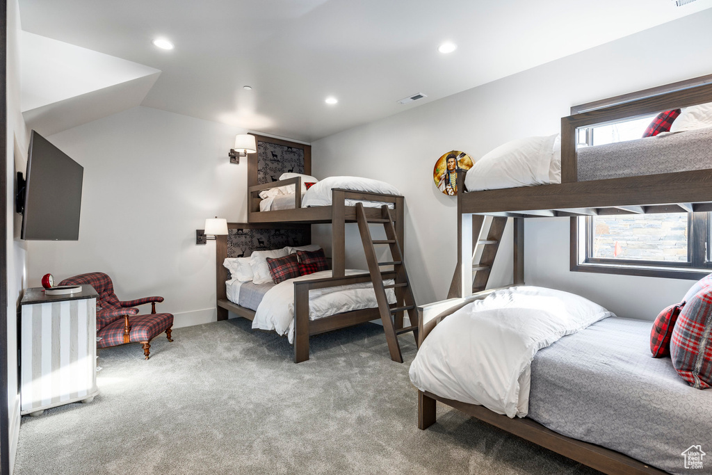 Carpeted bedroom with recessed lighting