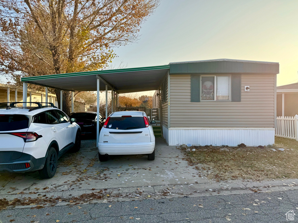 Parking at dusk with a carport