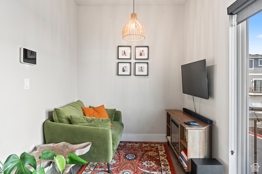 Living area with hardwood / wood-style floors