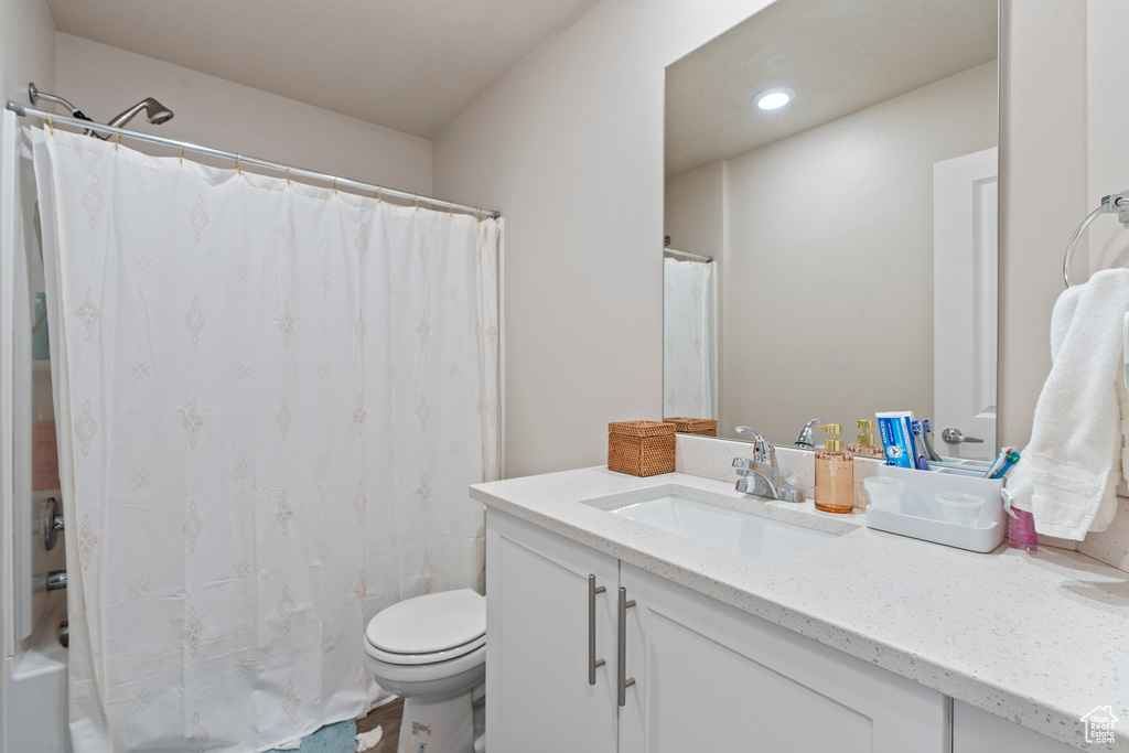 Bathroom with vanity and toilet
