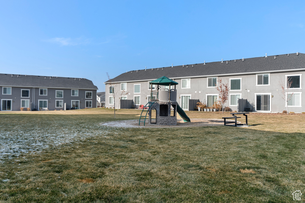 View of play area with a yard