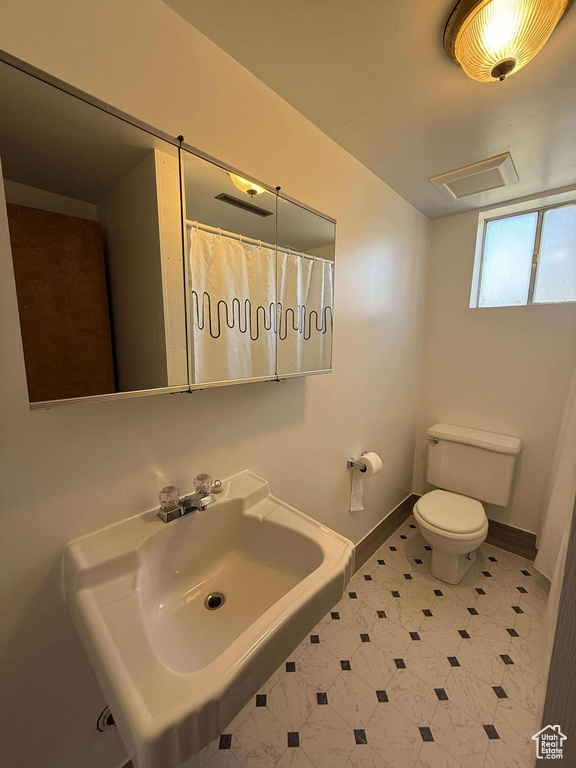 Bathroom with toilet and sink