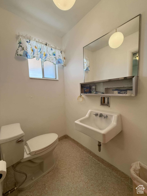 Bathroom featuring sink and toilet