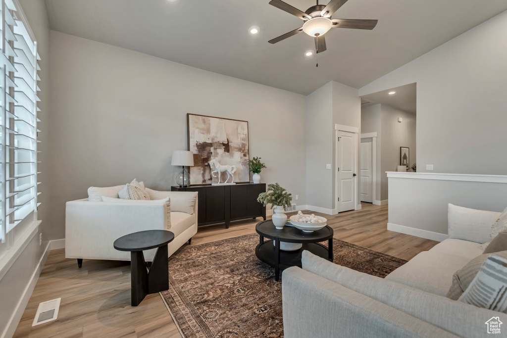 Living area featuring visible vents, a ceiling fan, light wood-style flooring, and recessed lighting