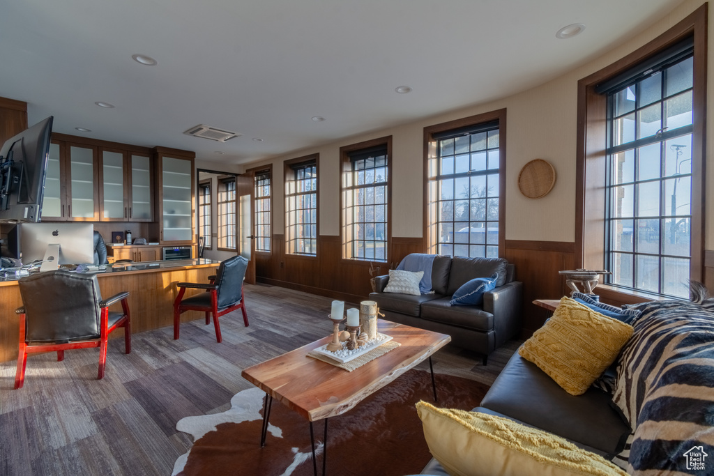Living room featuring dark hardwood / wood-style flooring and plenty of natural light