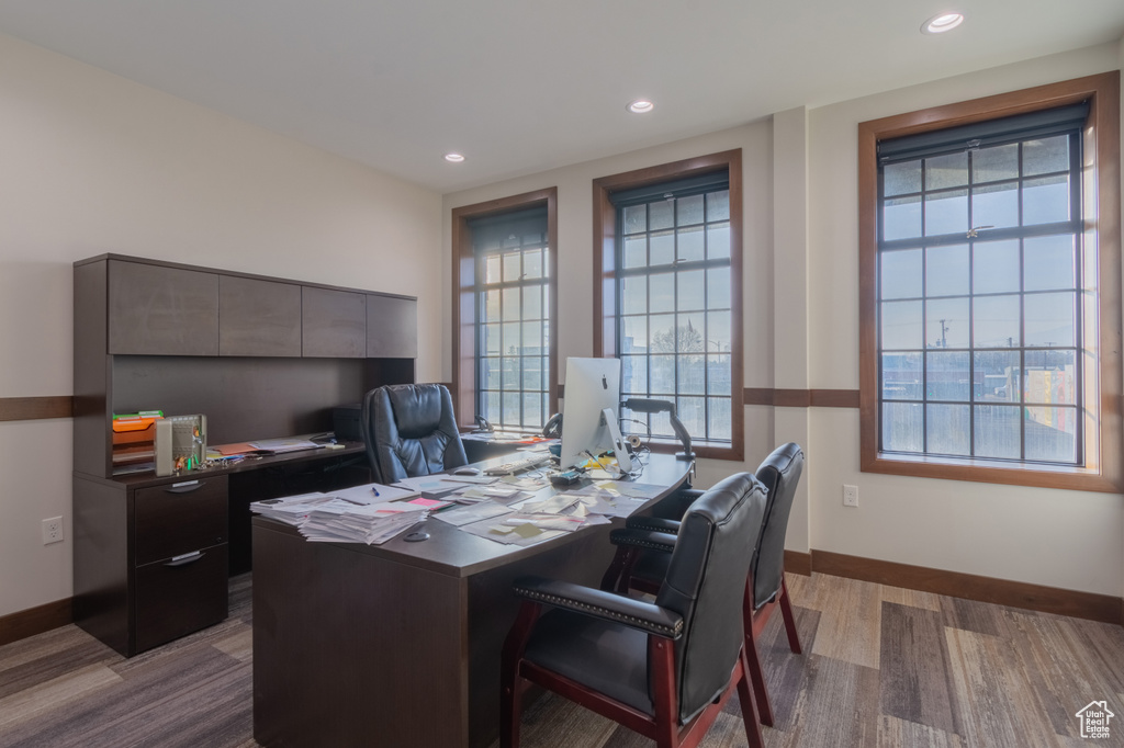 Office area with light hardwood / wood-style flooring