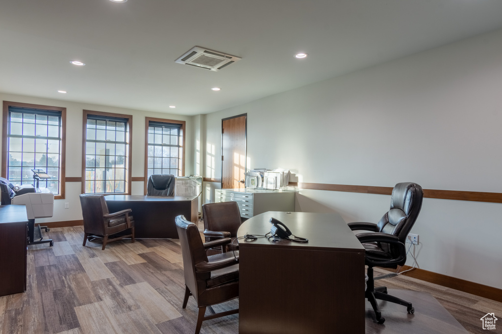 Home office with light wood-type flooring