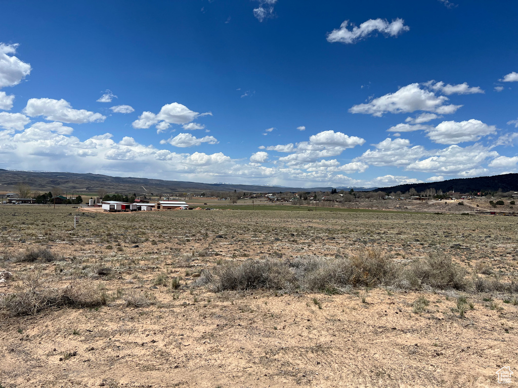 Property view of mountains with a rural view