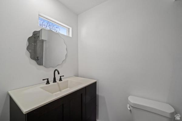 Bathroom featuring vanity and toilet