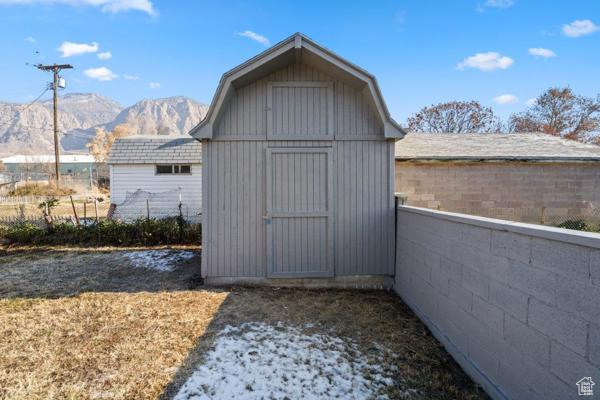 View of outbuilding with a mountain view