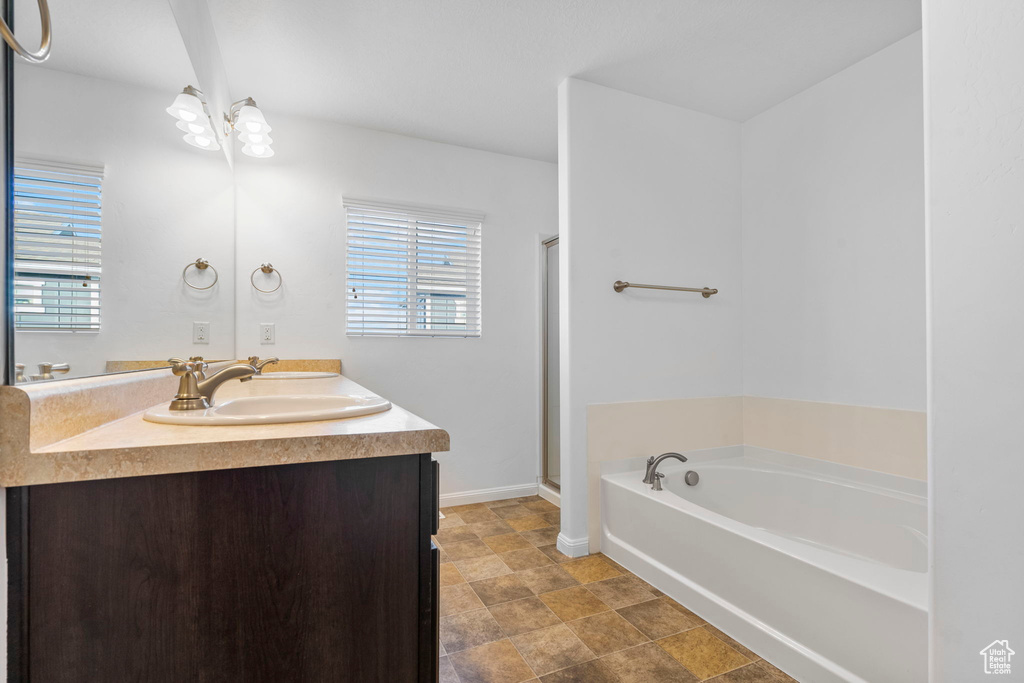 Bathroom with plus walk in shower and vanity