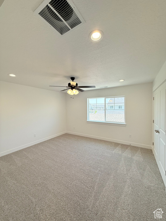 Unfurnished room featuring recessed lighting, light carpet, baseboards, and ceiling fan
