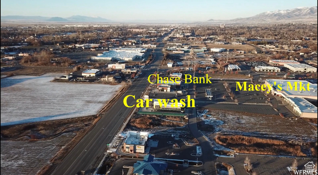 Birds eye view of property with a mountain view