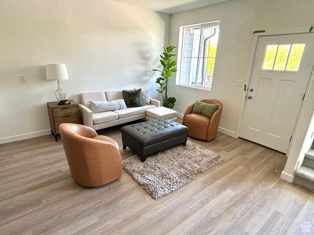 Living area featuring wood finished floors and baseboards