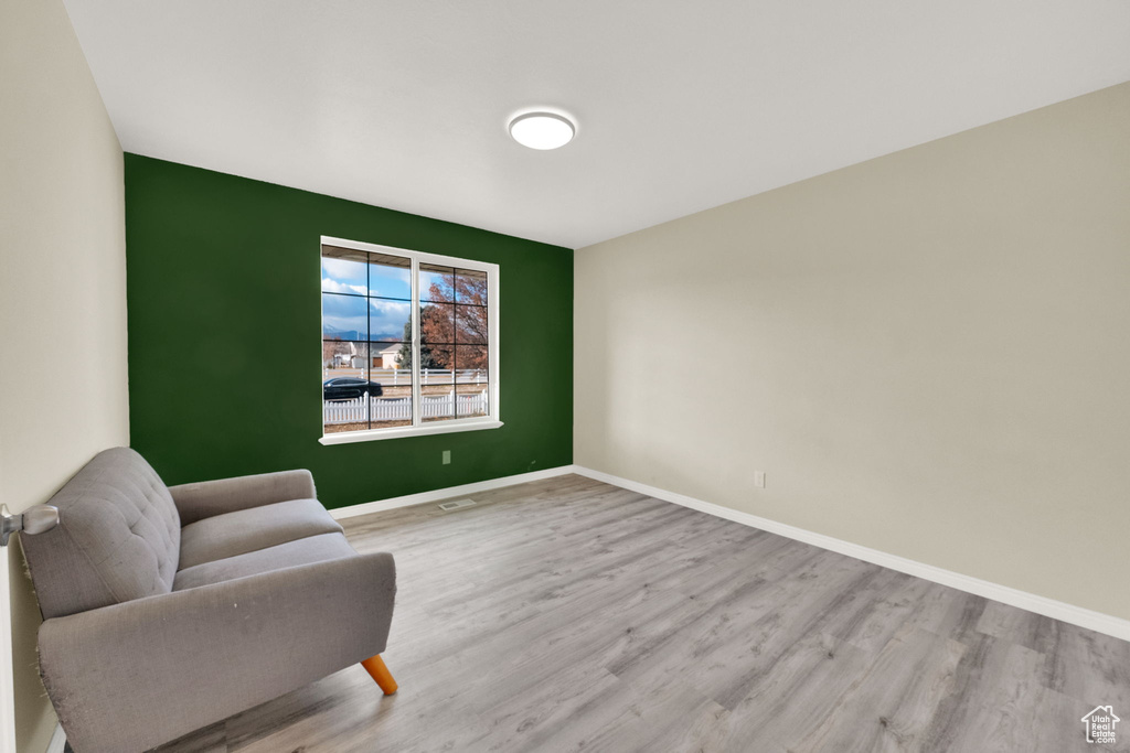 Sitting room featuring light hardwood / wood-style flooring