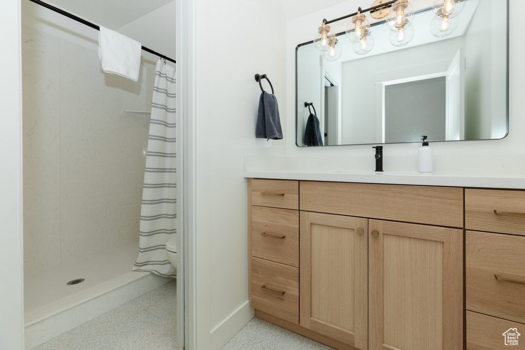 Bathroom featuring vanity and walk in shower