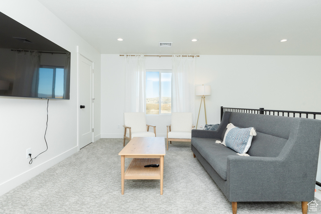 Living room featuring light colored carpet