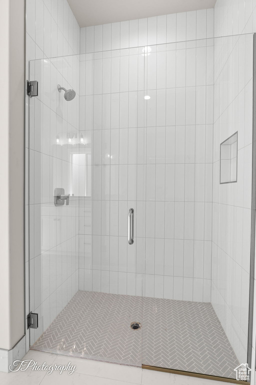 Full bathroom with a shower stall