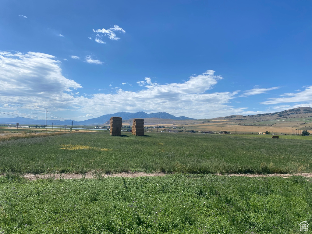 Property view of mountains with a rural view