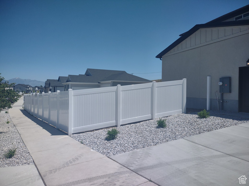 View of property exterior featuring a mountain view and stucco siding