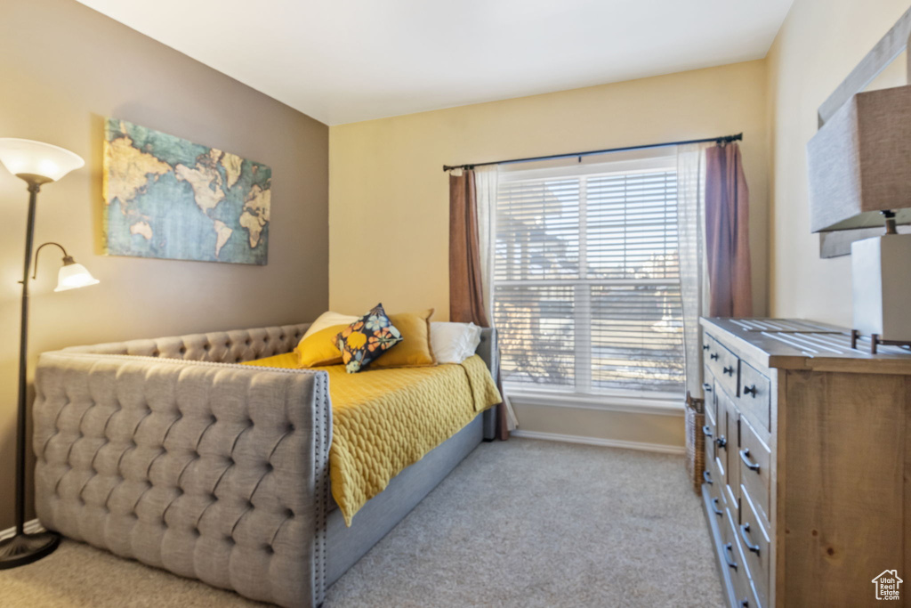 Bedroom with light colored carpet