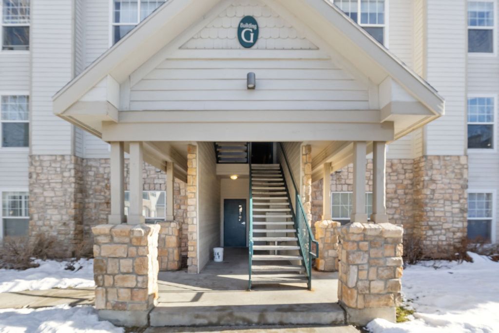 View of snow covered property entrance