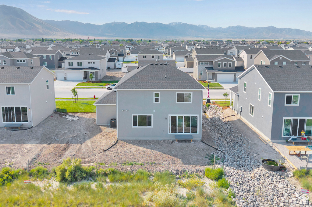 Aerial view of residential area featuring a mountain backdrop