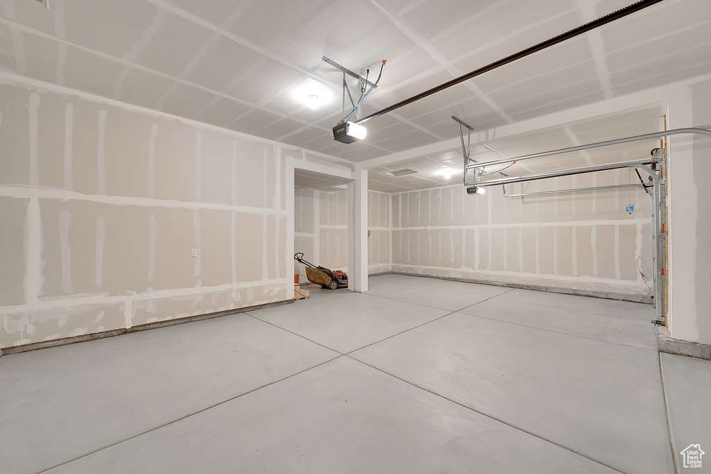 Garage featuring a garage door opener