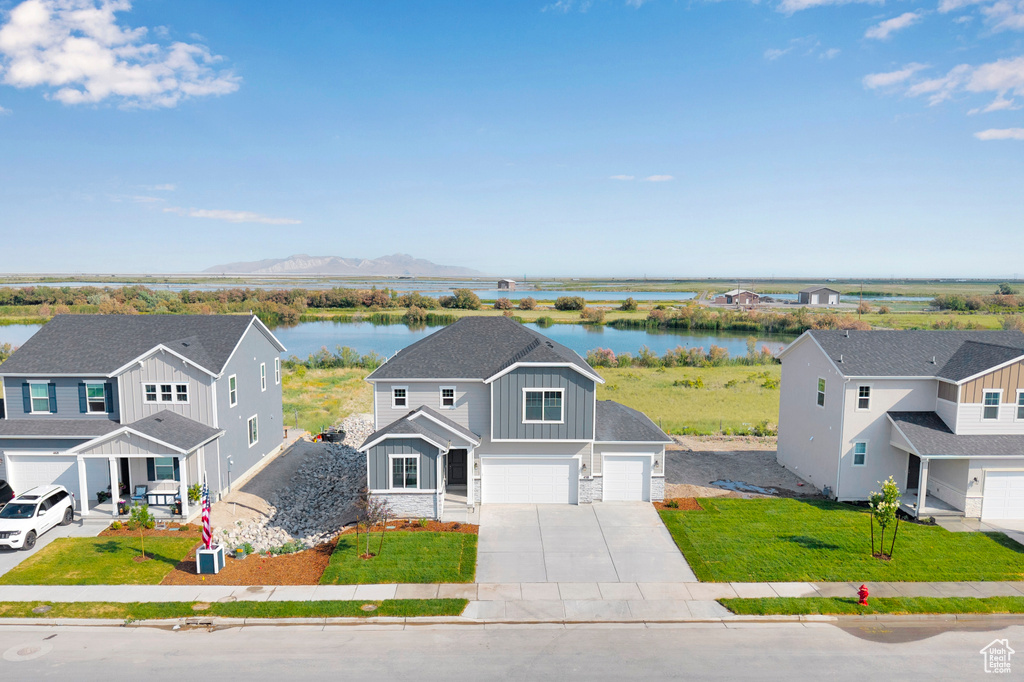View of subject property featuring a water and mountain view