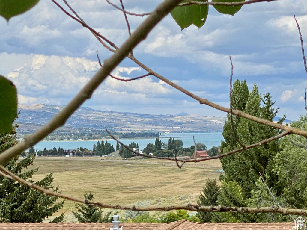 View of water feature with a mountain view